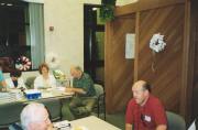 At our July 24, 2003 meeting: In the distance are Frances Calvacca and Sally Konley, survivor of room 106, and Ralph Bonaccorsi (Director of the Abuse Ministry from the Catholic Archdiocese). In the foreground are Bill O'Brien and John Molitor, survivors of room 209. (Photo courtesy of Charlene Jancik)